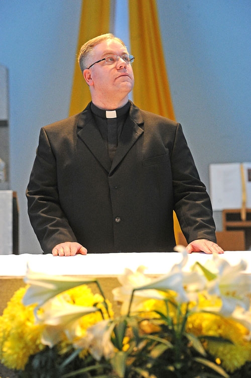 Deacon Martin Gallagher stands at the altar in St John Vianney Chapel on the Christ the King Seminary campus as he prepares for his ordination at St. Joseph Cathedral on June 3rd. (Dan Cappellazzo/Staff Photographer)